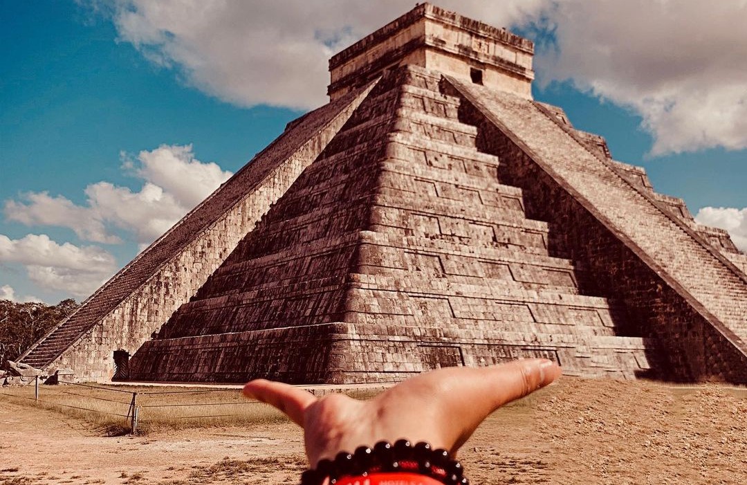 Exploring Chichen Itza with a certified tour guide.