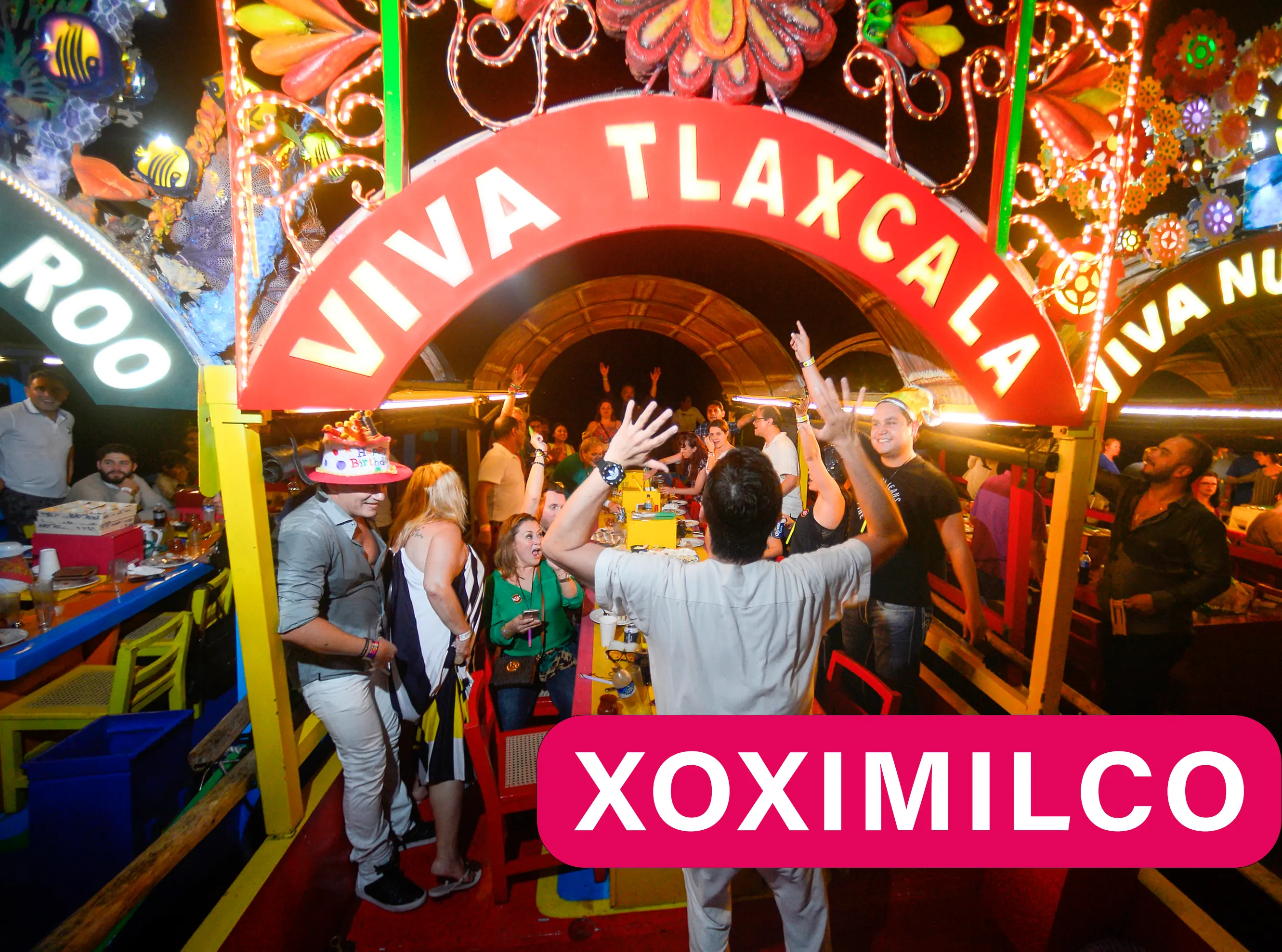 People having fun at Xoximilco enjoying a Mexican party in the Riviera Maya